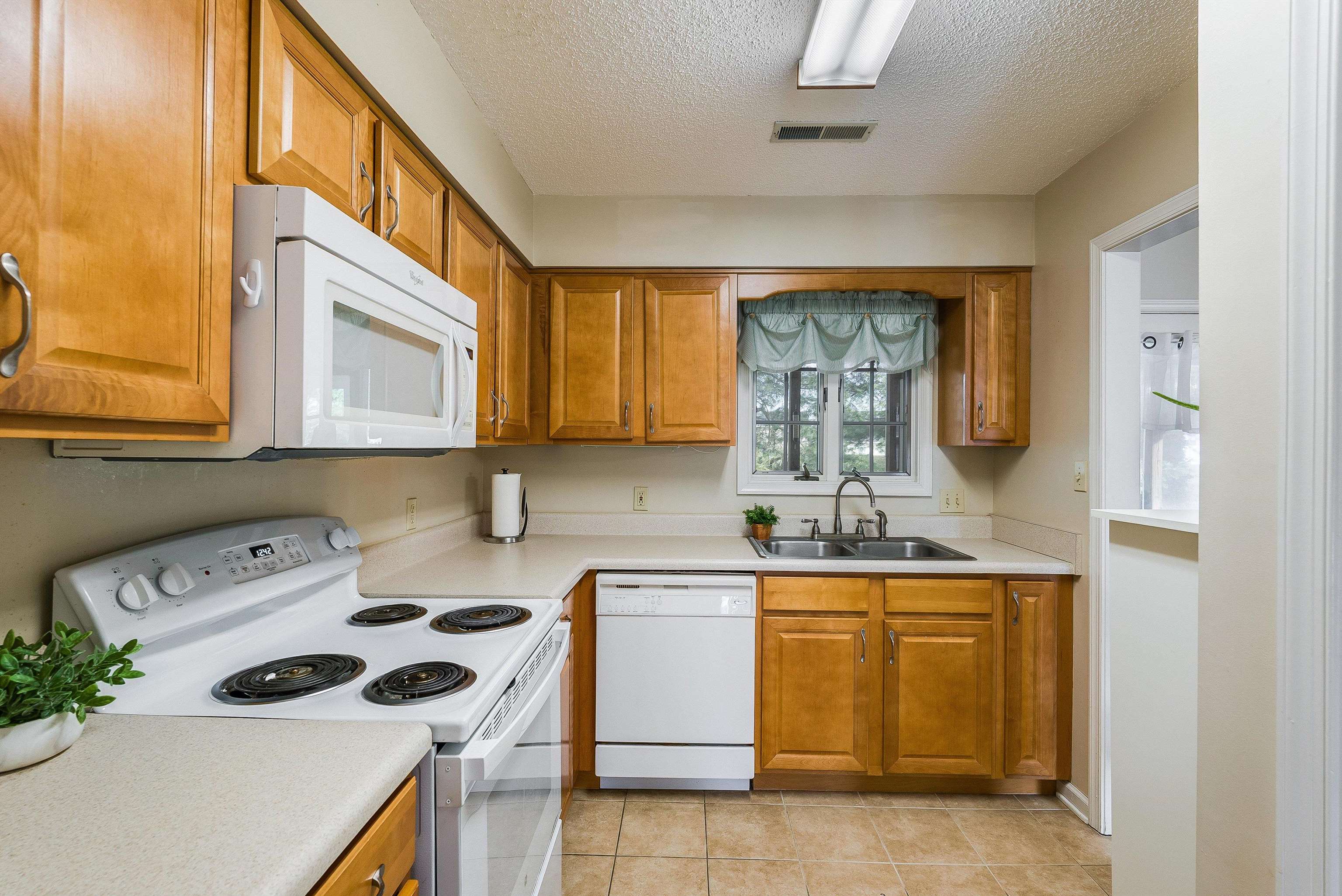 2015 Hampton Drive Waynesboro, VA 22980 - Photo 13 of 31 a kitchen with a stove a sink and a microwave