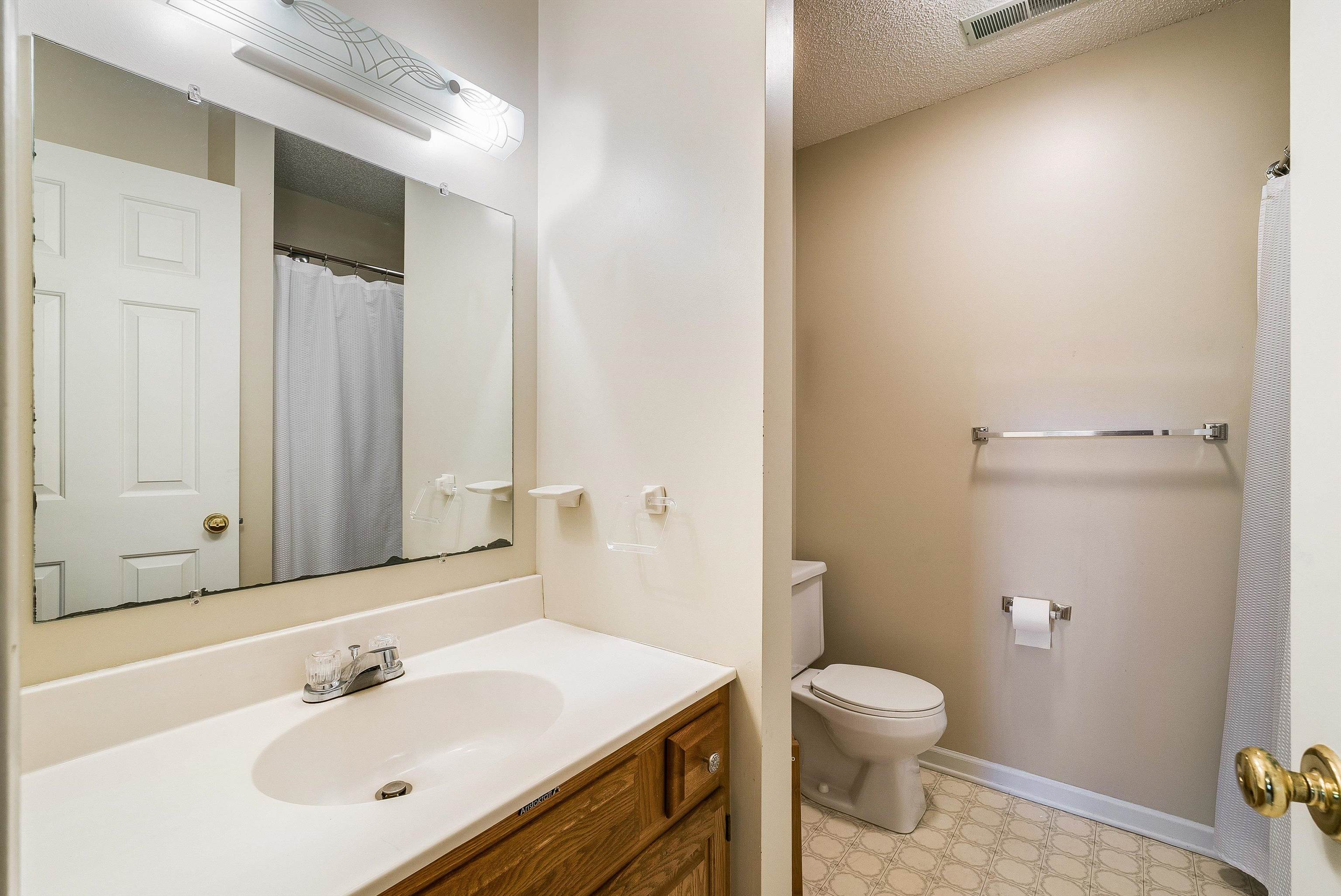 2015 Hampton Drive Waynesboro, VA 22980 - Photo 22 of 31 a bathroom with a sink a toilet and shower