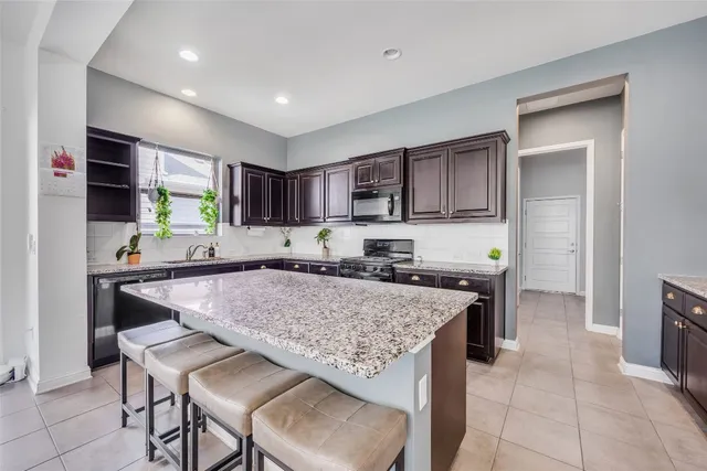 a kitchen with a stove a refrigerator and a refrigerator