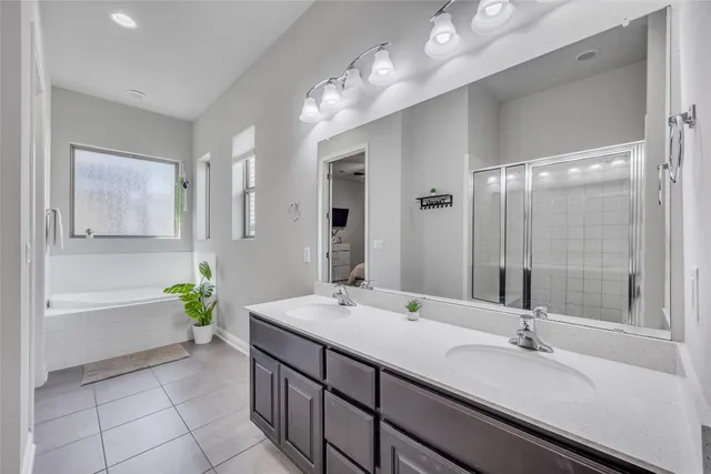 a bathroom with a bathtub and a sink