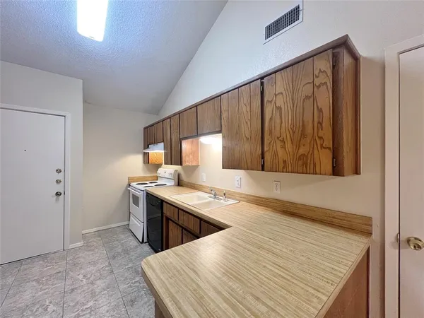 a view of a kitchen with a sink