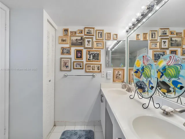 a bathroom with a sink a vanity and a mirror