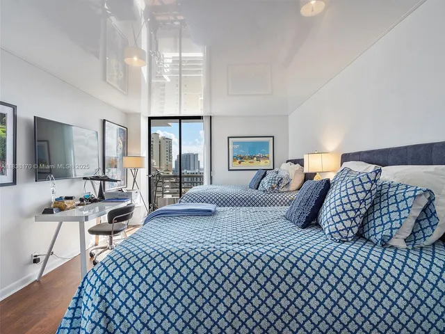 a bedroom with double bed and a night stand