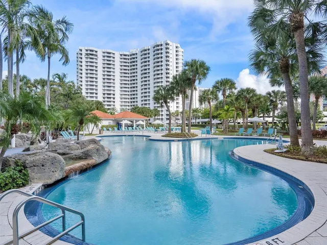 a view of a swimming pool with sitting area