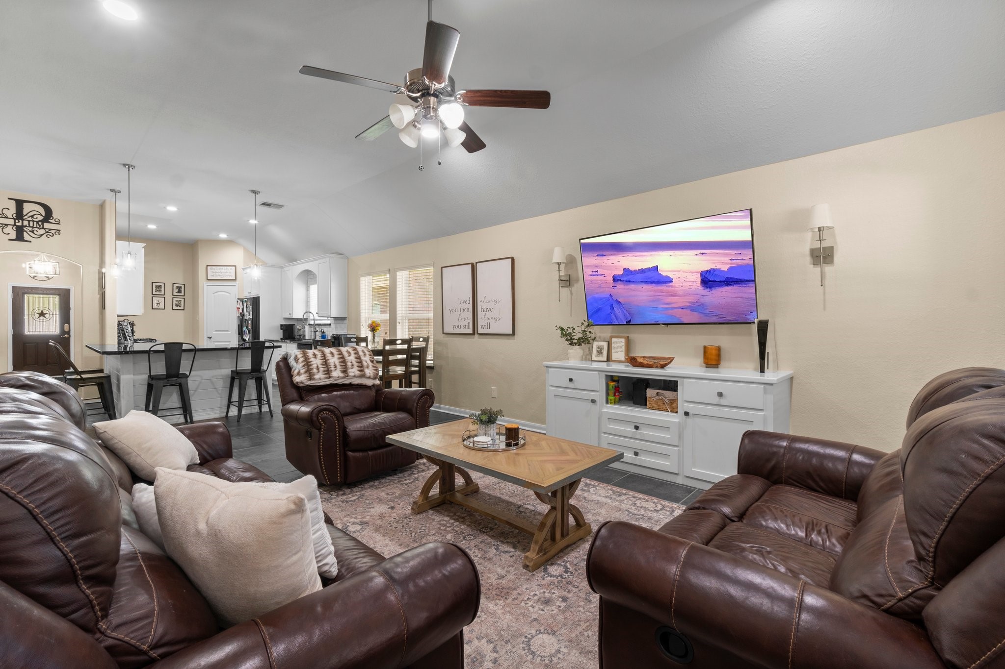 28987 Birch Green Way Spring, TX 77386 - Photo 13 of 32 a living room with furniture kitchen and a flat screen tv