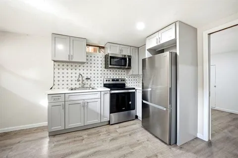 a view of a house with a street