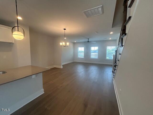 8524 Silsbee Drive Raleigh, NC 27613 - Photo 12 of 15 an empty room with wooden floor and windows