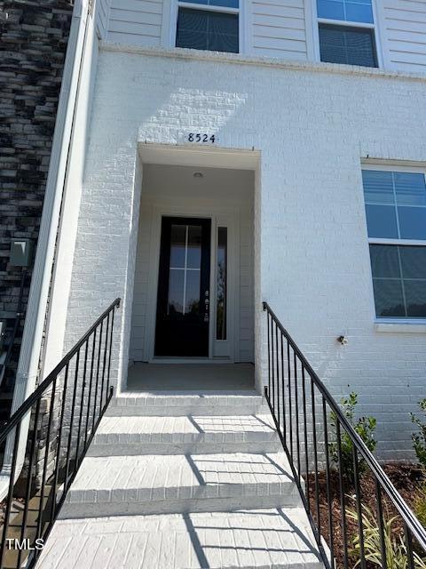 8524 Silsbee Drive Raleigh, NC 27613 - Photo 2 of 15 a view of a porch with wooden floor and stairs