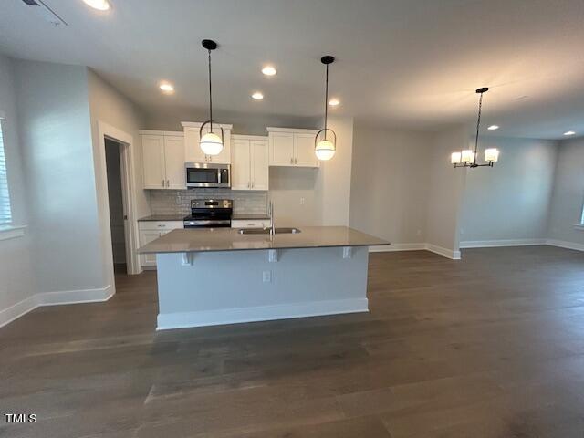 8524 Silsbee Drive Raleigh, NC 27613 - Photo 5 of 15 a view of kitchen with refrigerator and window