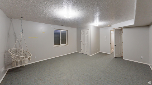 9029 North Treasureton Road Preston, ID 83263 - Photo 15 of 31 Unfurnished bedroom featuring a textured ceiling and carpet floors