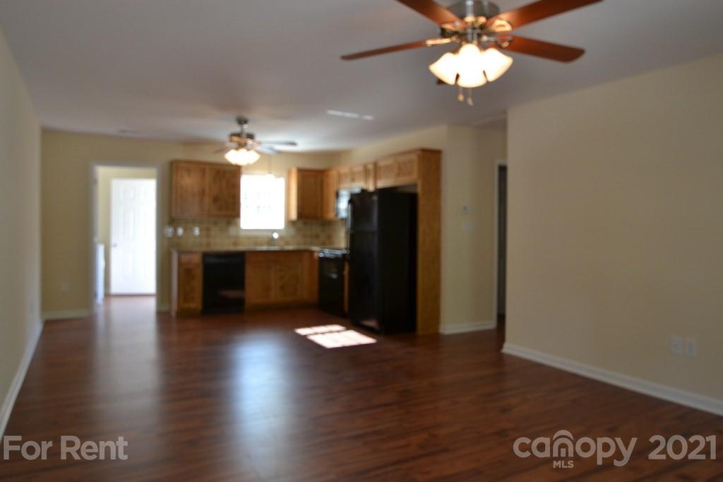 3801 Lee Moore Road Maiden, NC 28650 - Photo 2 of 14 a view of kitchen with granite countertop cabinets and refrigerator