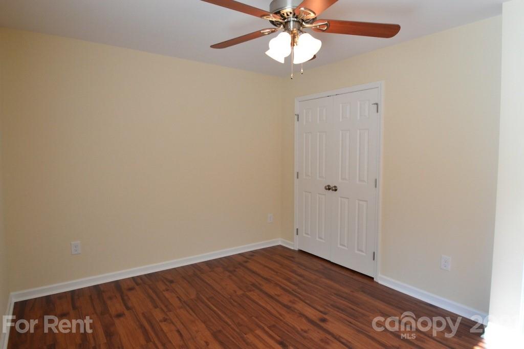 3801 Lee Moore Road Maiden, NC 28650 - Photo 11 of 14 a view of an empty room with wooden floor