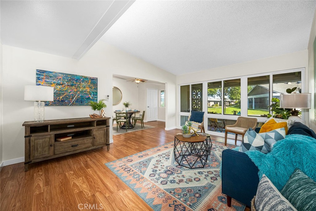 1240 Oakmont Road, Unit 52I Seal Beach, CA 90740 - Photo 17 of 33 a living room with furniture and a floor to ceiling window