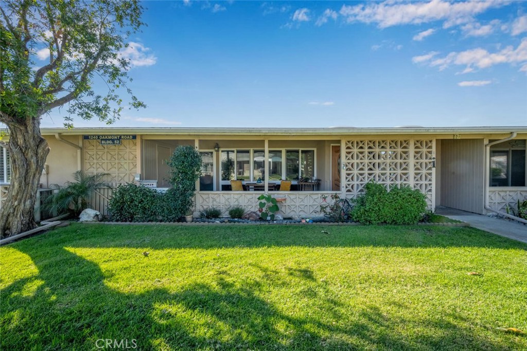 1240 Oakmont Road, Unit 52I Seal Beach, CA 90740 - Photo 2 of 33 a view of a house with a yard porch and sitting area