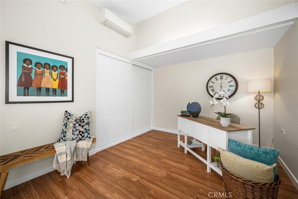 1240 Oakmont Road, Unit 52I Seal Beach, CA 90740 - Photo 21 of 33 a living room with furniture a clock on wall and a table