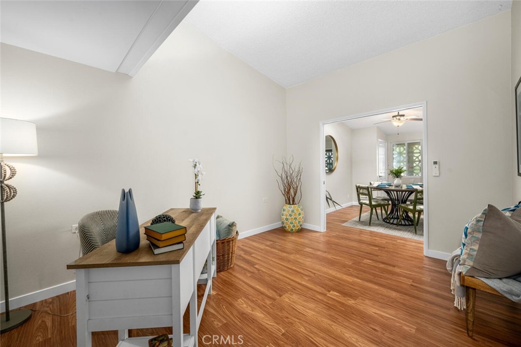 1240 Oakmont Road, Unit 52I Seal Beach, CA 90740 - Photo 22 of 33 a bedroom with a bed a desk and chair