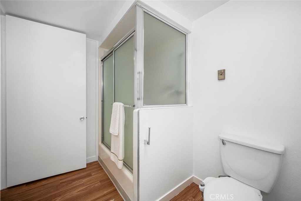 1240 Oakmont Road, Unit 52I Seal Beach, CA 90740 - Photo 28 of 33 a bathroom with a toilet and a shower