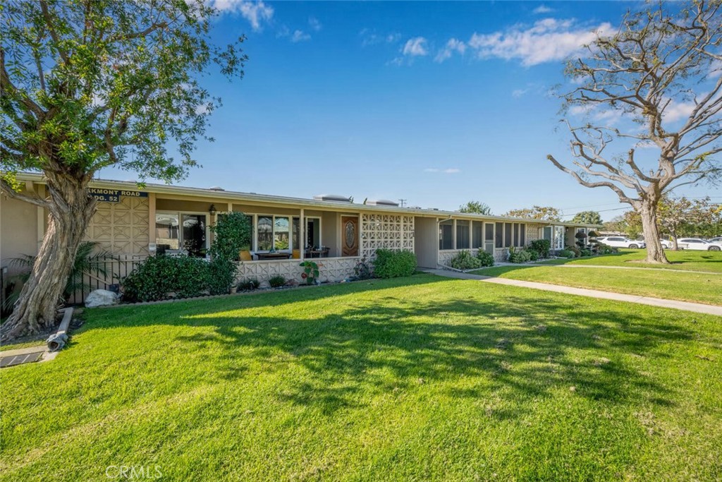 1240 Oakmont Road, Unit 52I Seal Beach, CA 90740 - Photo 3 of 33 a view of a house with a big yard