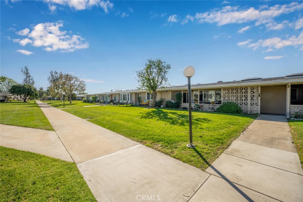 1240 Oakmont Road, Unit 52I Seal Beach, CA 90740 - Photo 33 of 33 a view of a house with a yard