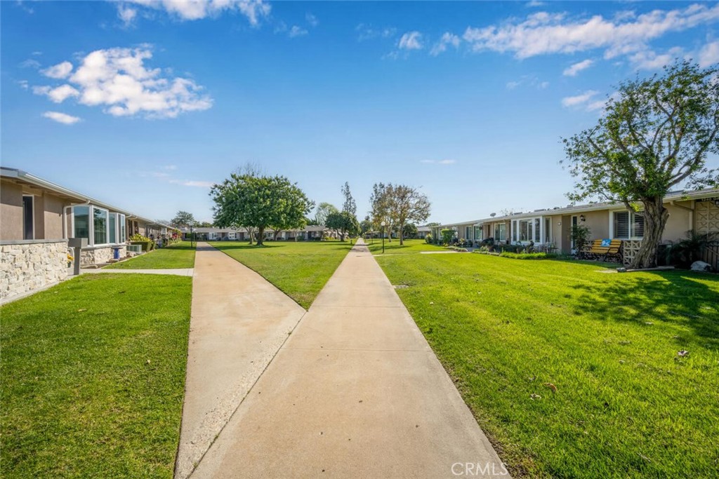 1240 Oakmont Road, Unit 52I Seal Beach, CA 90740 - Photo 5 of 33 a view of a house with a swimming pool