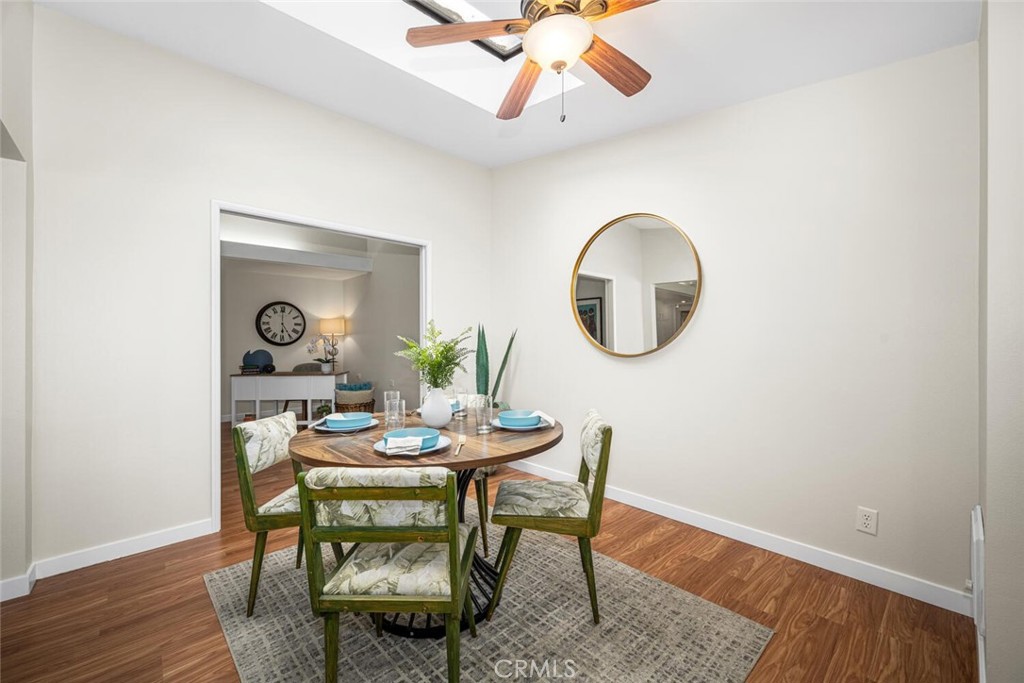 1240 Oakmont Road, Unit 52I Seal Beach, CA 90740 - Photo 10 of 33 a dining room with furniture and a mirror
