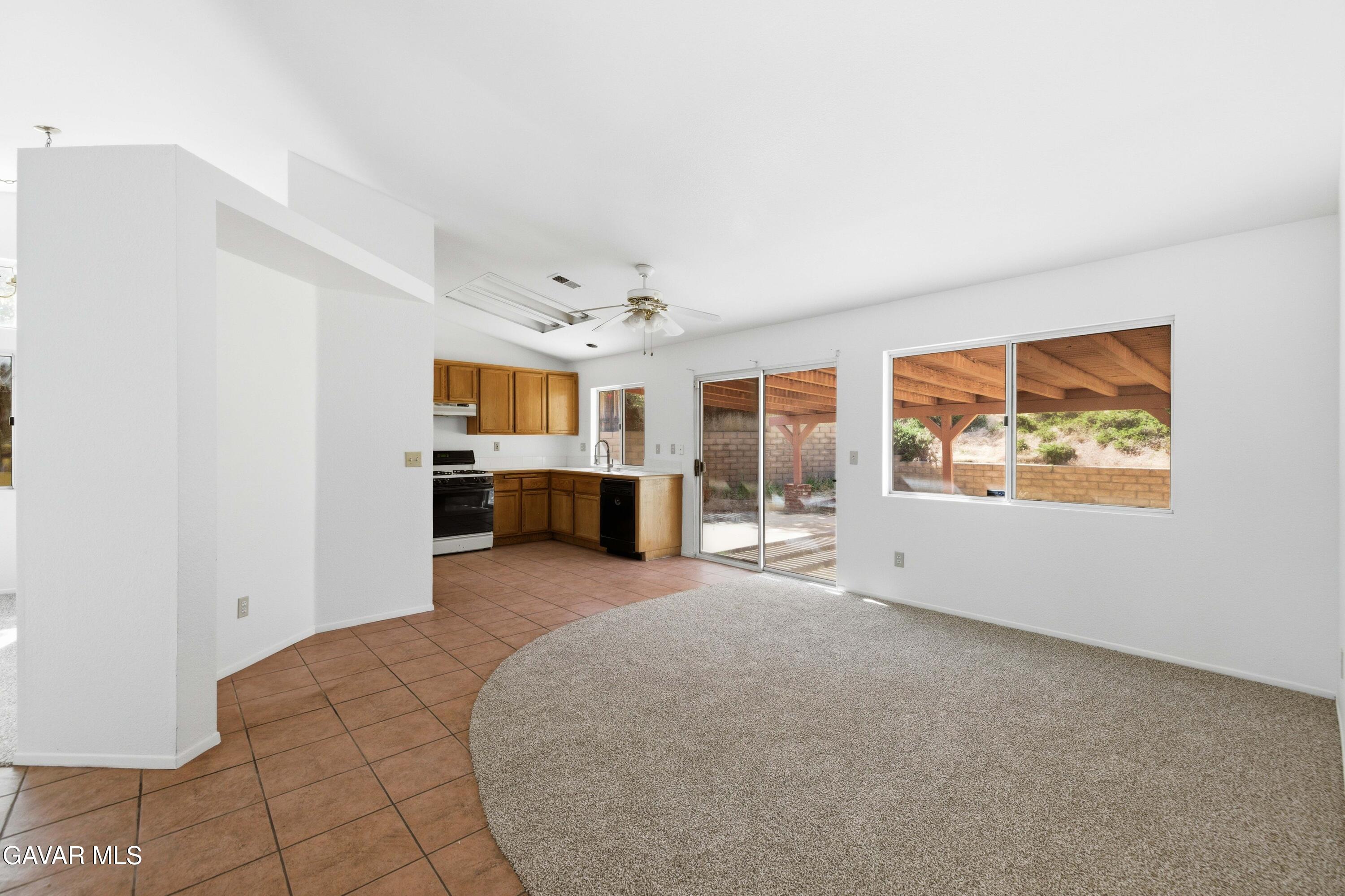 3254 Quarry Road Palmdale, CA 93550 - Photo 13 of 30 a large room with chandelier and couches