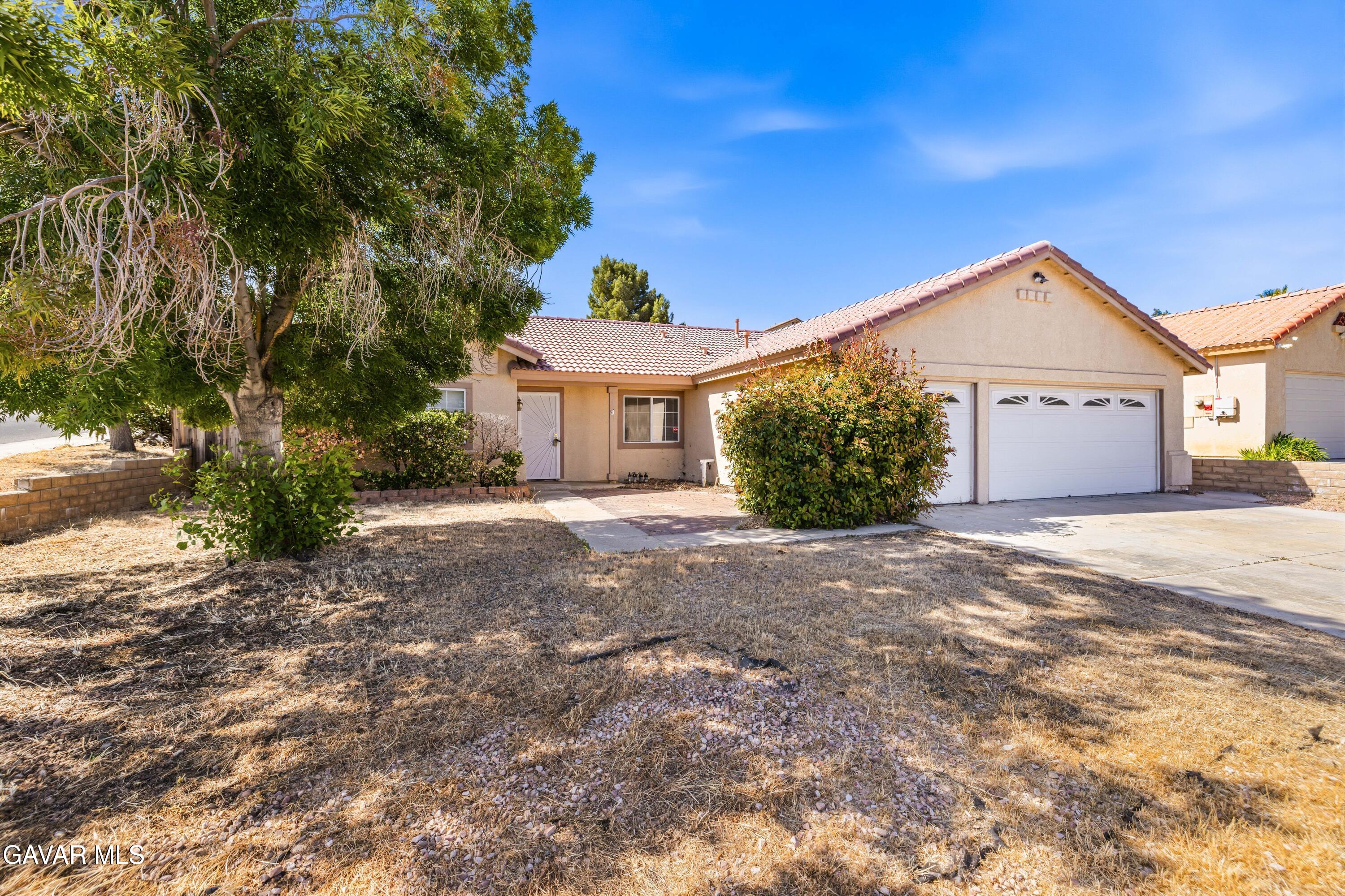 3254 Quarry Road Palmdale, CA 93550 - Photo 2 of 30 a front view of a house with garden