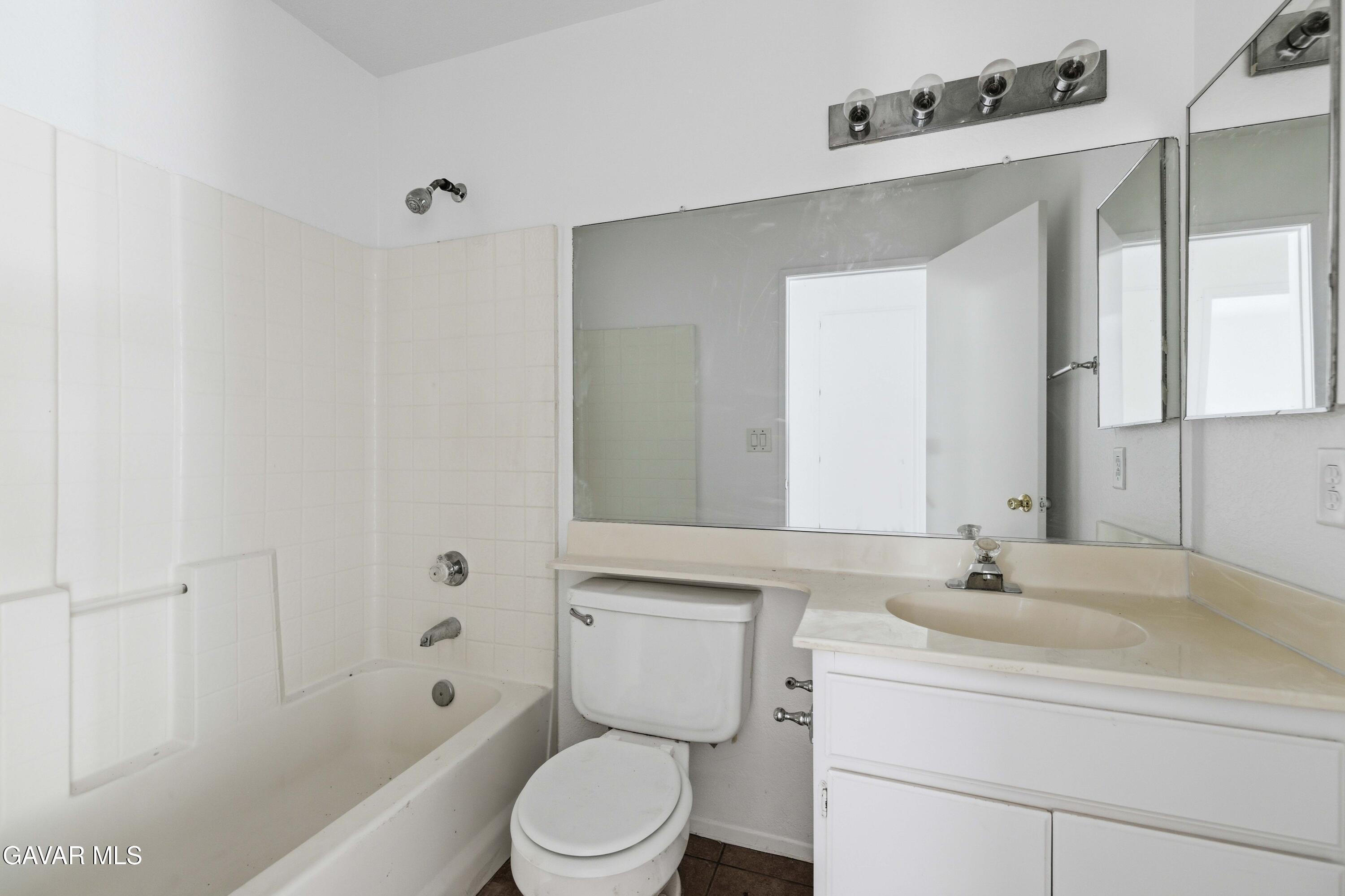 3254 Quarry Road Palmdale, CA 93550 - Photo 23 of 30 a bathroom with a sink a toilet and shower