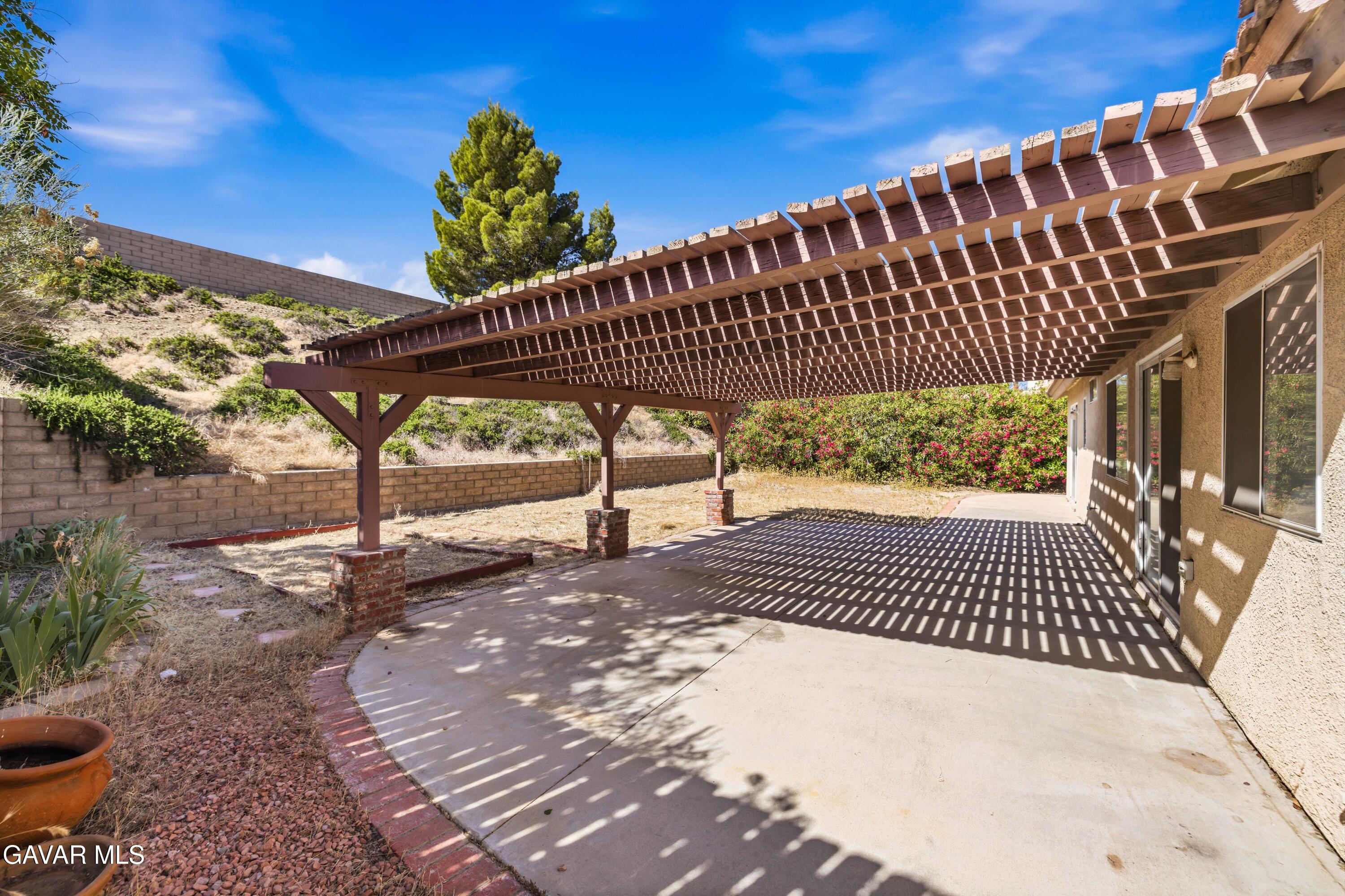 3254 Quarry Road Palmdale, CA 93550 - Photo 25 of 30 a view of a backyard with a swing