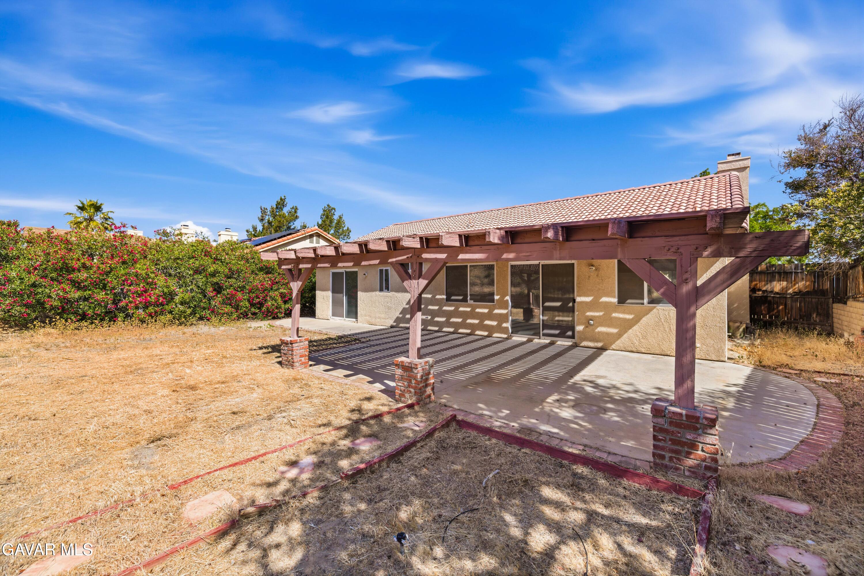 3254 Quarry Road Palmdale, CA 93550 - Photo 26 of 30 a view of a house with a yard