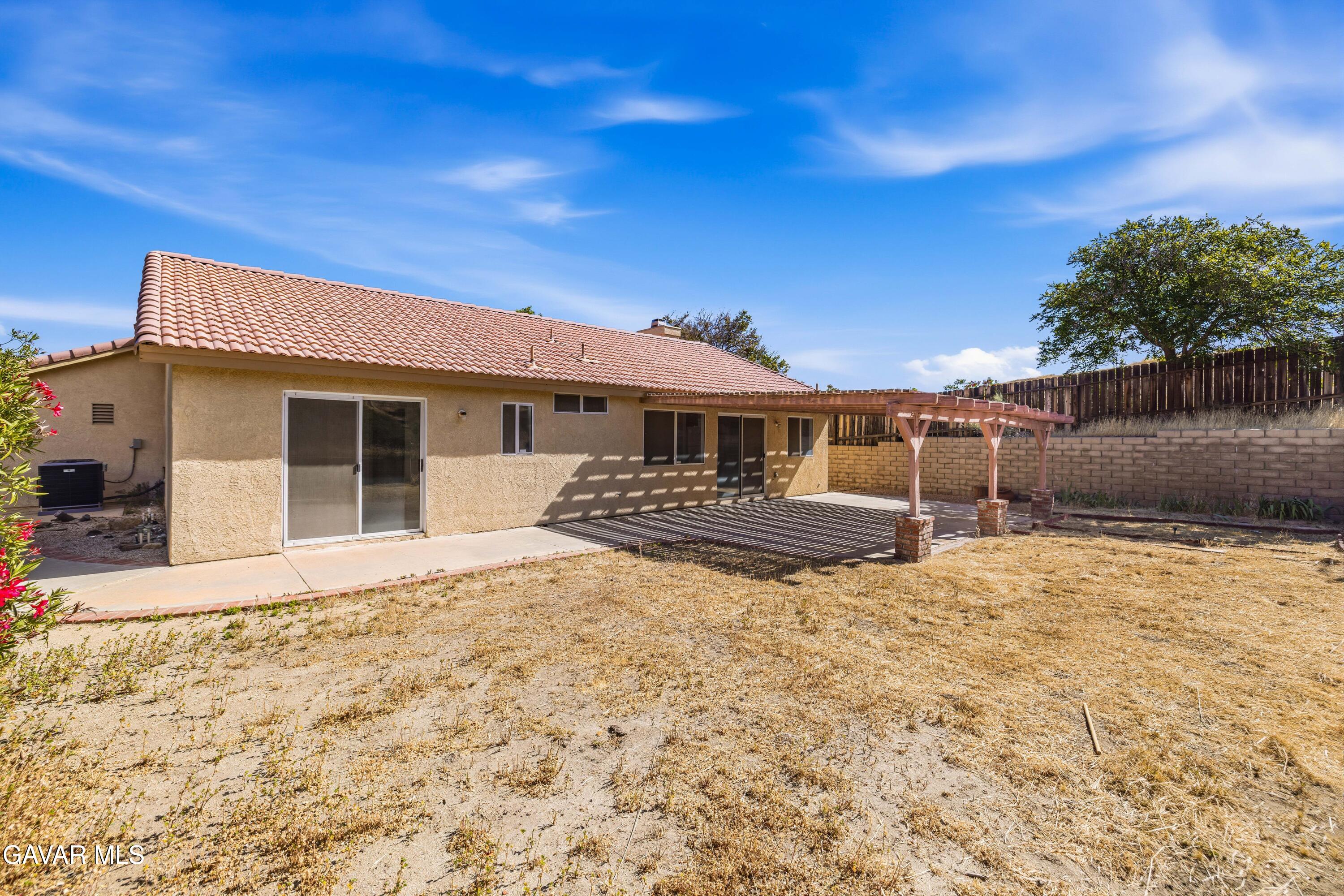 3254 Quarry Road Palmdale, CA 93550 - Photo 27 of 30 a front view of a house with a yard