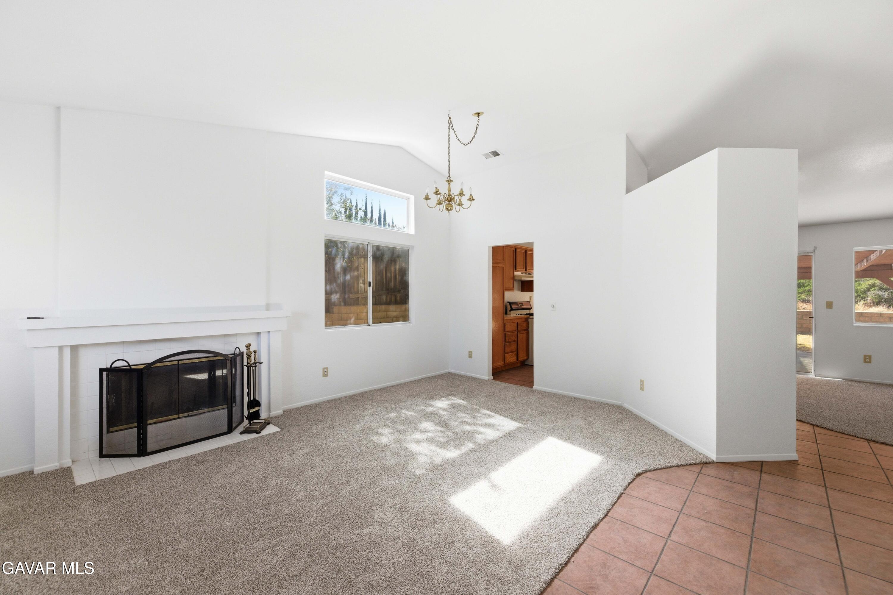 3254 Quarry Road Palmdale, CA 93550 - Photo 3 of 30 a view of a livingroom with a fireplace