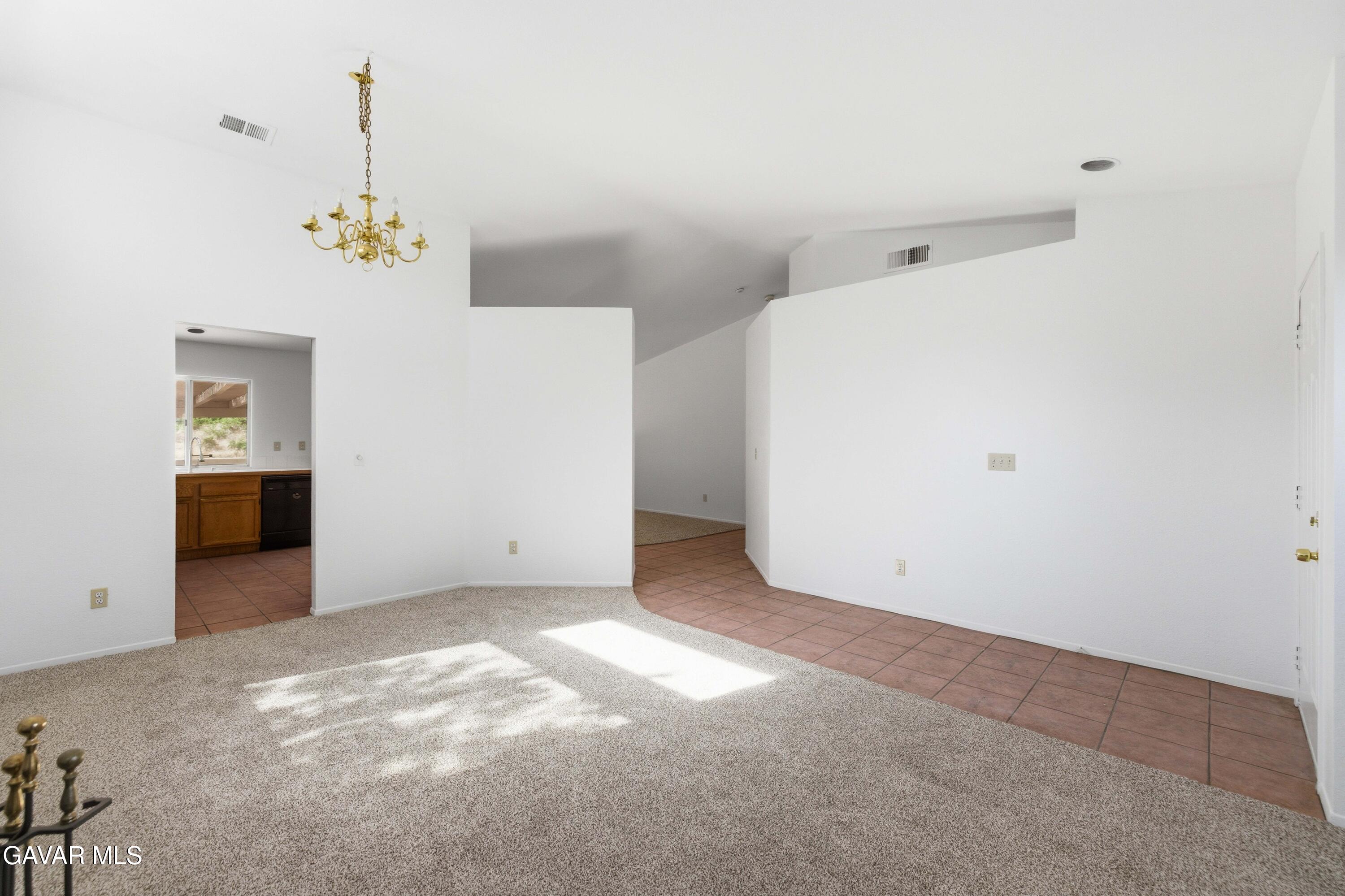3254 Quarry Road Palmdale, CA 93550 - Photo 4 of 30 an empty room with closet and windows
