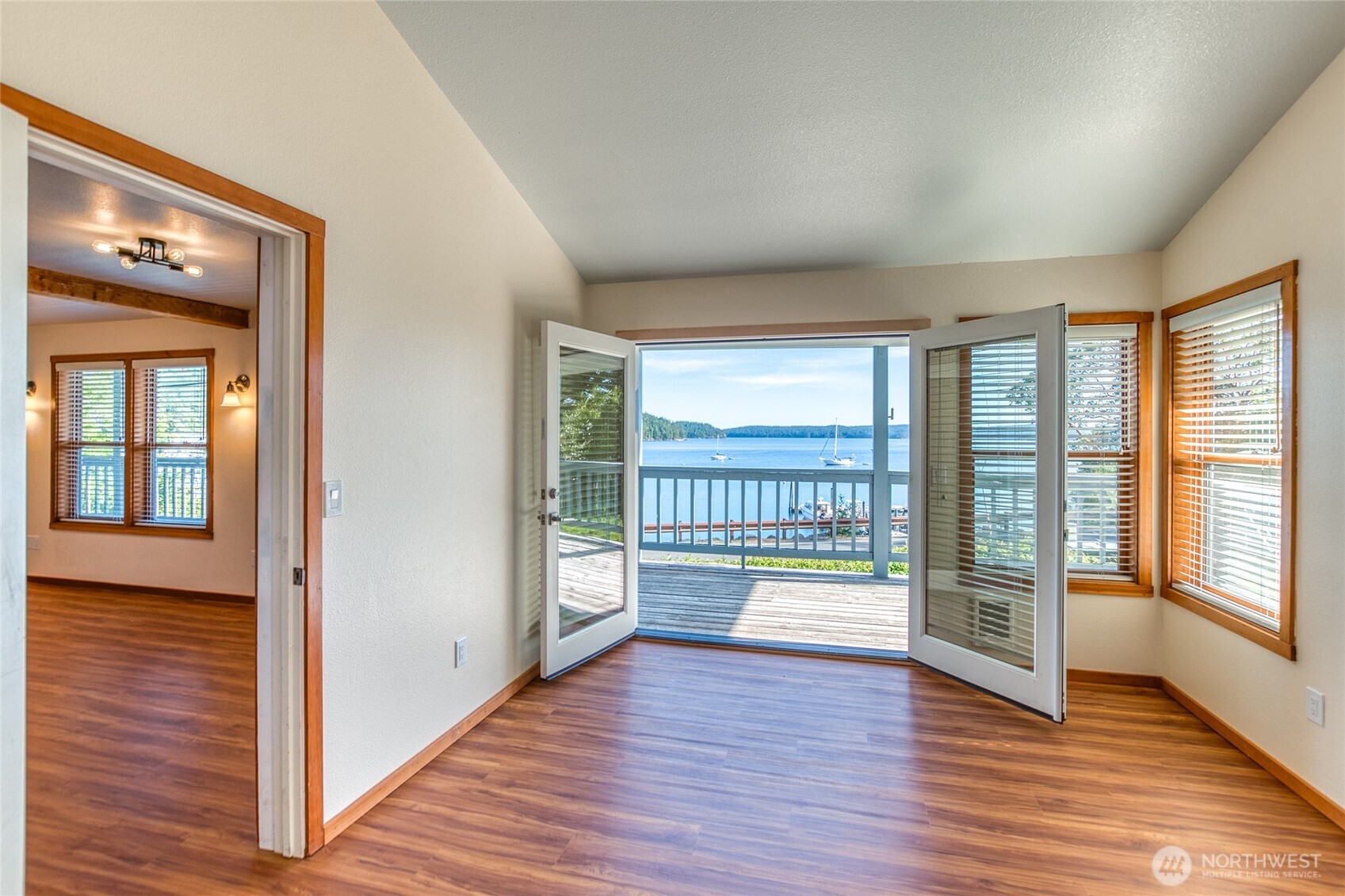 942 Deer Harbor Road Orcas Island, WA 98245 - Photo 12 of 40 a view of an empty room with wooden floor and a window