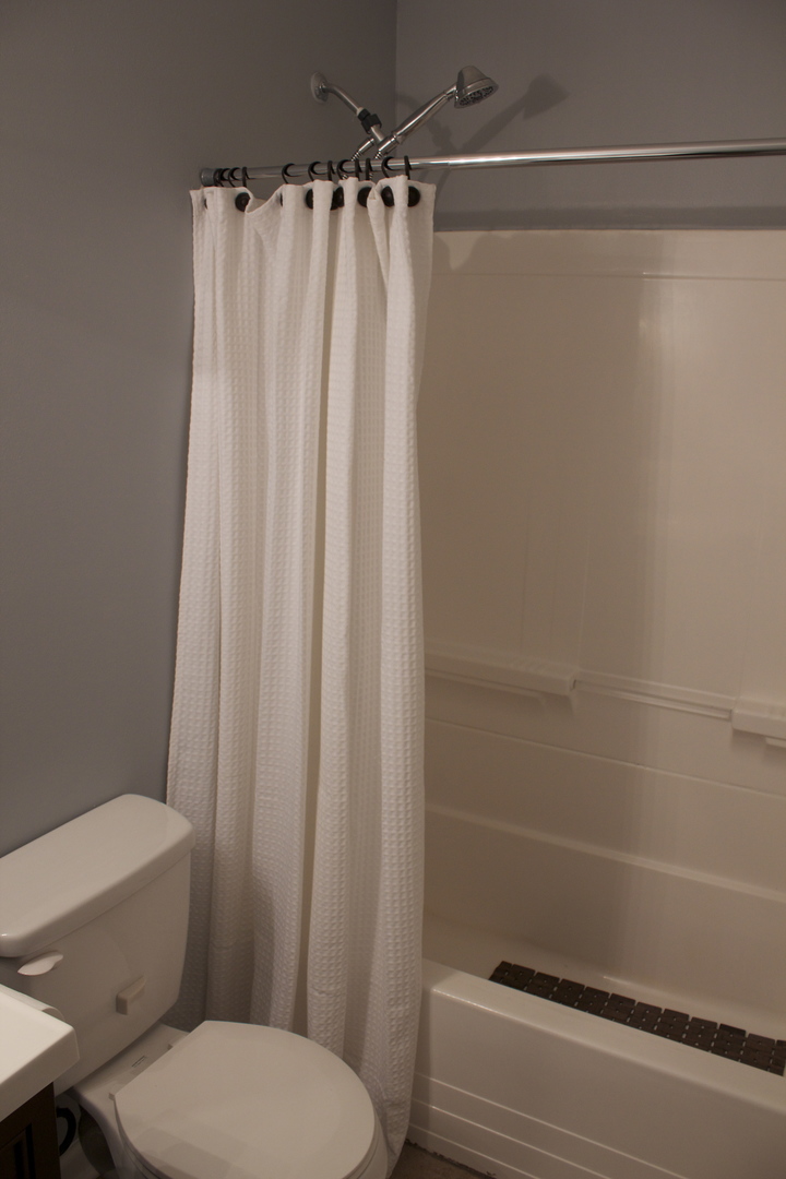 57 Springdale Road Montgomery, IL 60538 - Photo 14 of 19 a bathroom with a shower curtain and sink
