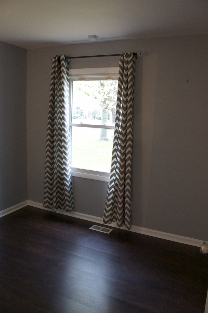 57 Springdale Road Montgomery, IL 60538 - Photo 15 of 19 an empty room with wooden floor and windows