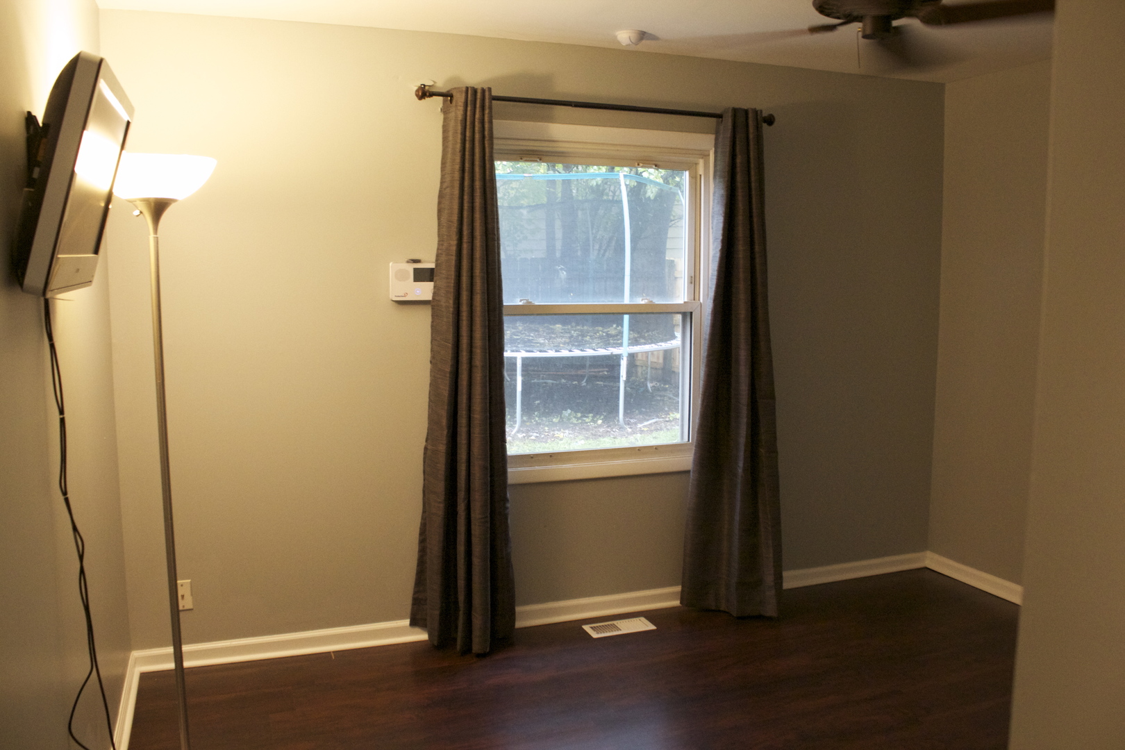 57 Springdale Road Montgomery, IL 60538 - Photo 17 of 19 an empty room with wooden floor and a window