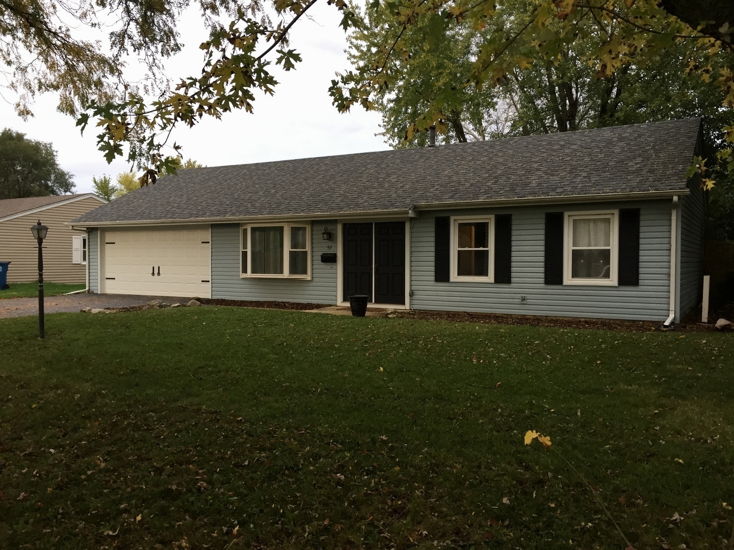 57 Springdale Road Montgomery, IL 60538 - Photo 19 of 19 a house view with a garden space