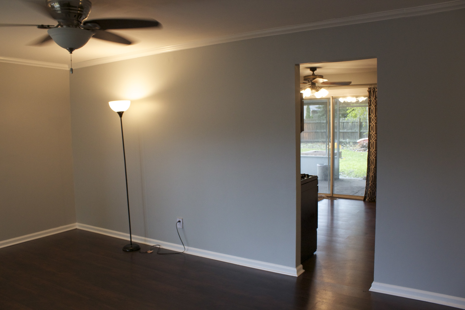 57 Springdale Road Montgomery, IL 60538 - Photo 5 of 19 a view of an empty room with wooden floor and a window