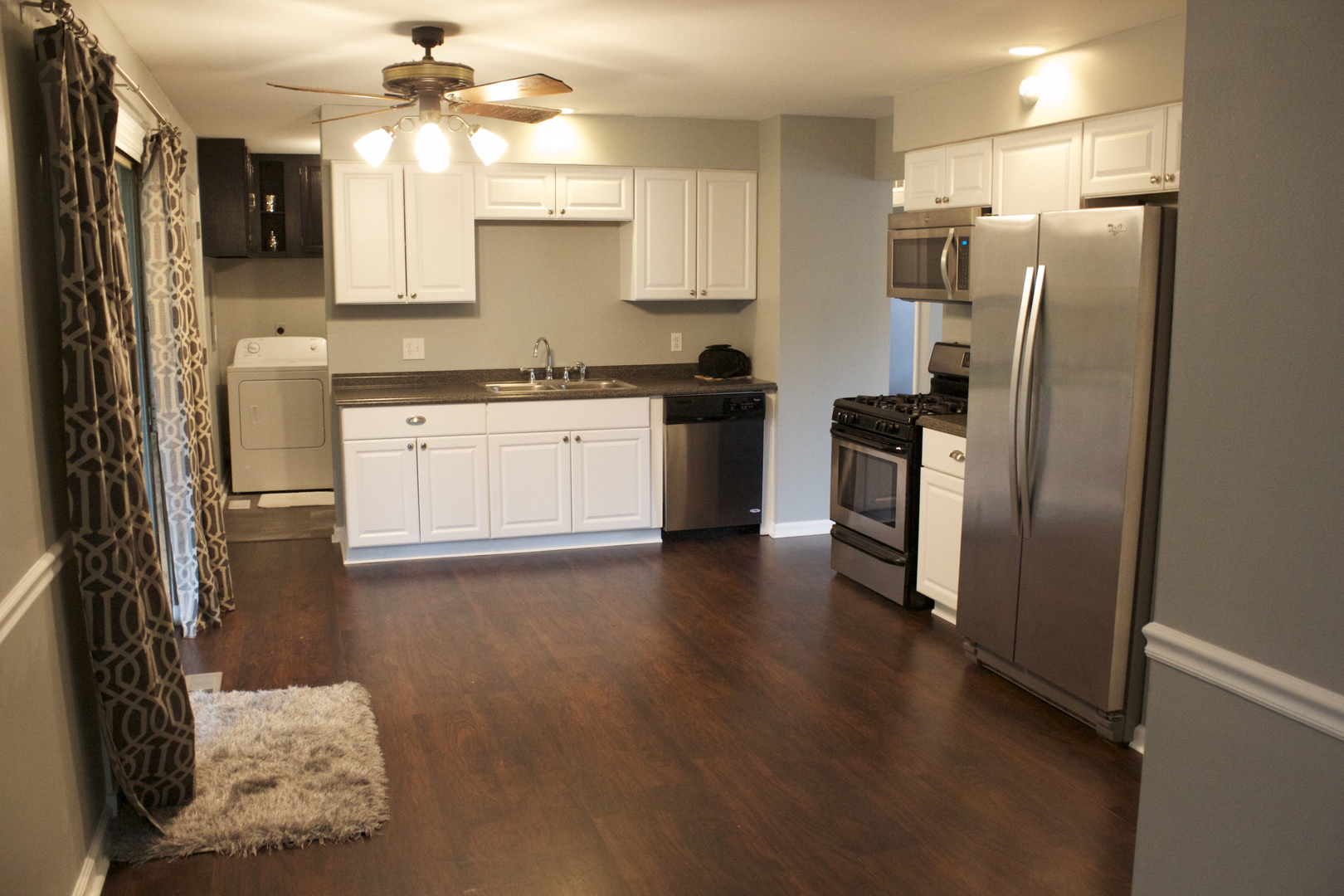57 Springdale Road Montgomery, IL 60538 - Photo 6 of 19 a kitchen with a refrigerator a stove top oven a sink and dishwasher