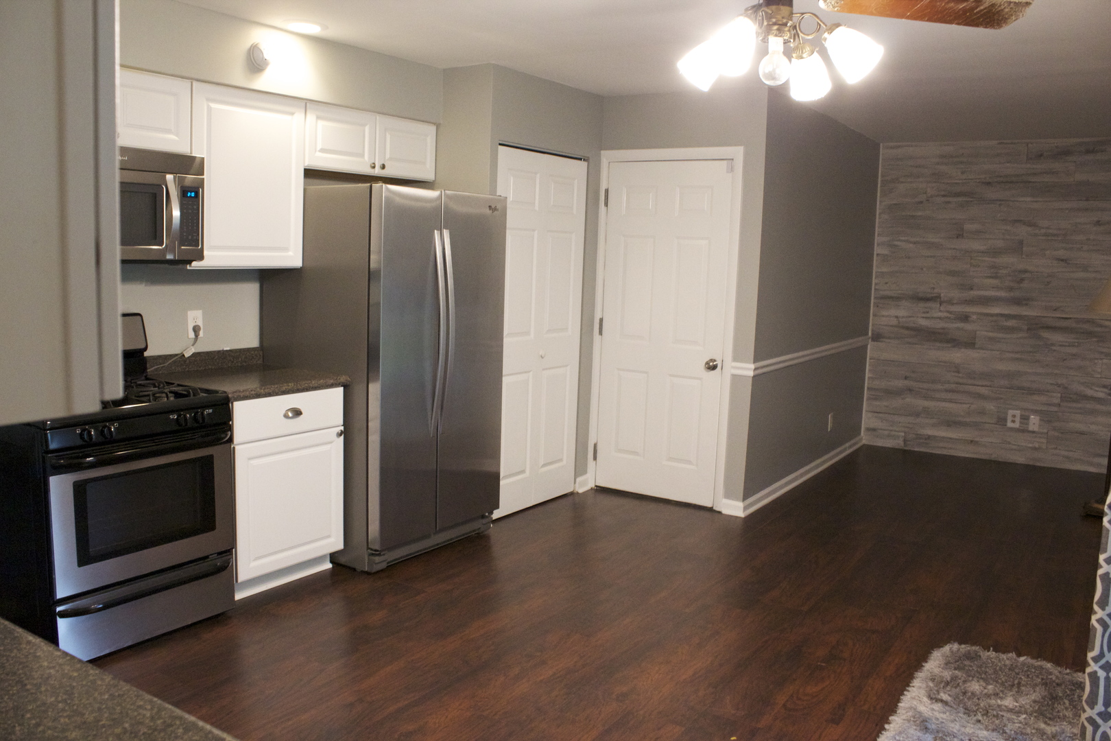 57 Springdale Road Montgomery, IL 60538 - Photo 7 of 19 a kitchen with a refrigerator stove and microwave