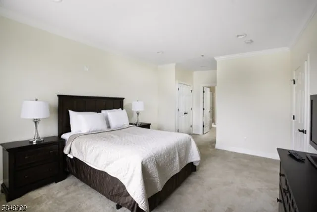 a bedroom with a bed and a lamp