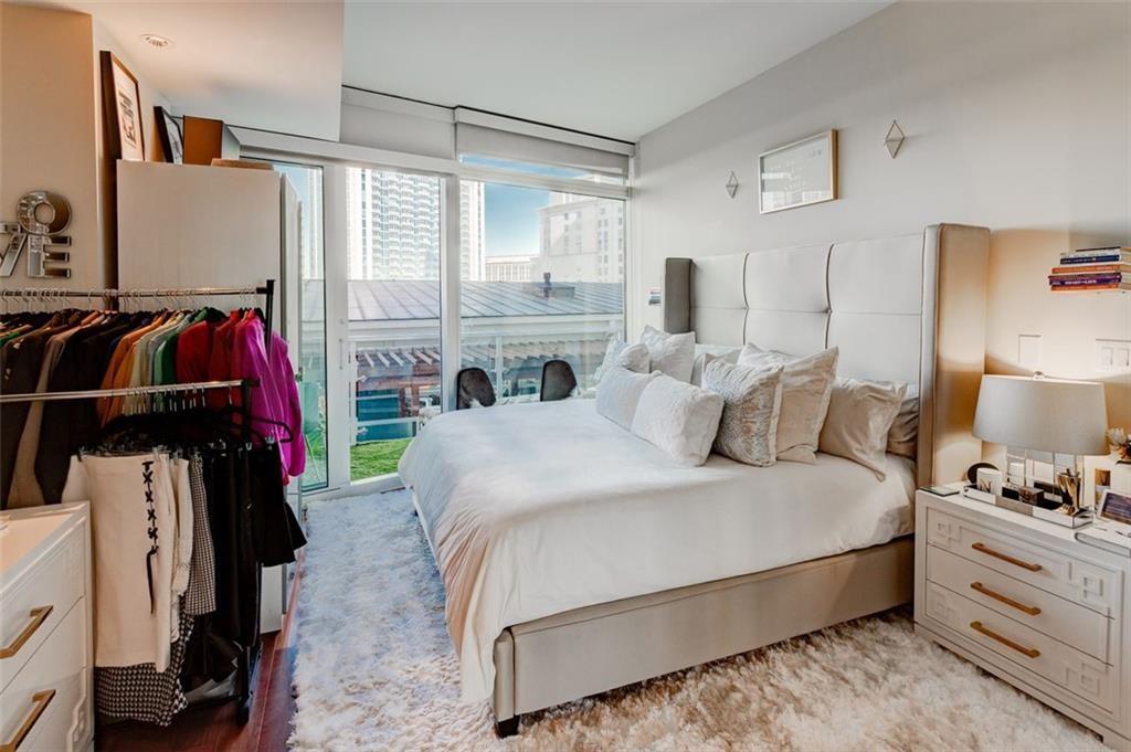 3325 Piedmont Road Northeast, Unit 1509 Atlanta, GA 30305 - Photo 14 of 29 a bed room with a bed and a window