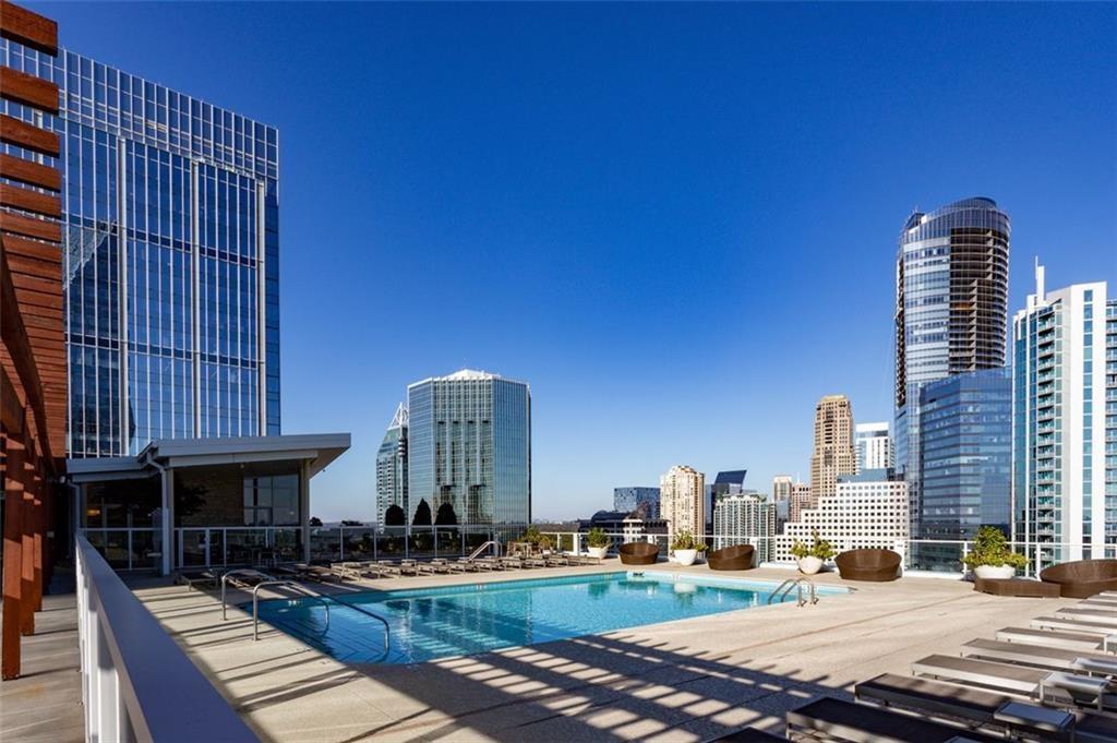 3325 Piedmont Road Northeast, Unit 1509 Atlanta, GA 30305 - Photo 20 of 29 a tall building sitting on the side of a street