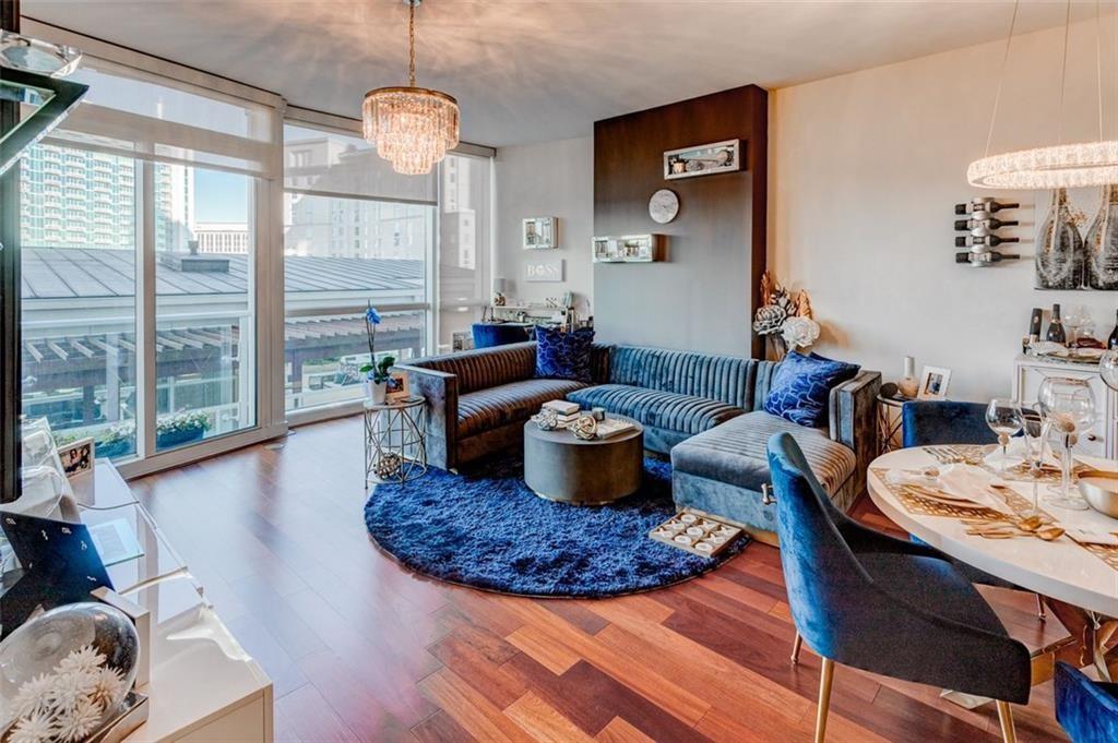 3325 Piedmont Road Northeast, Unit 1509 Atlanta, GA 30305 - Photo 2 of 29 a living room with furniture and a large window