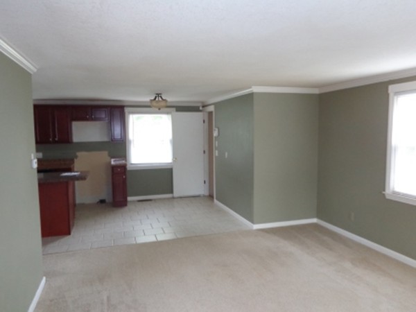 197 Mallowhill Road Springfield, MA 01129 - Photo 3 of 17 a view of empty room with a window and a kitchen