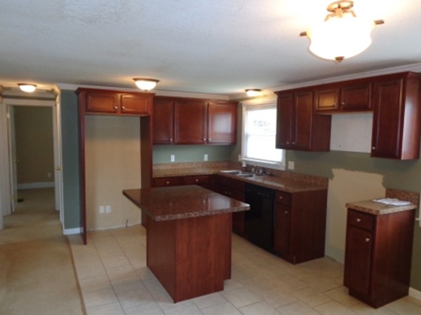 197 Mallowhill Road Springfield, MA 01129 - Photo 4 of 17 a kitchen with granite countertop a sink and a cabinets