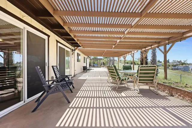 a view of a patio with wooden floor