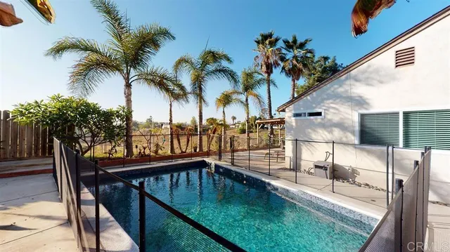 a view of swimming pool with a lounge chair