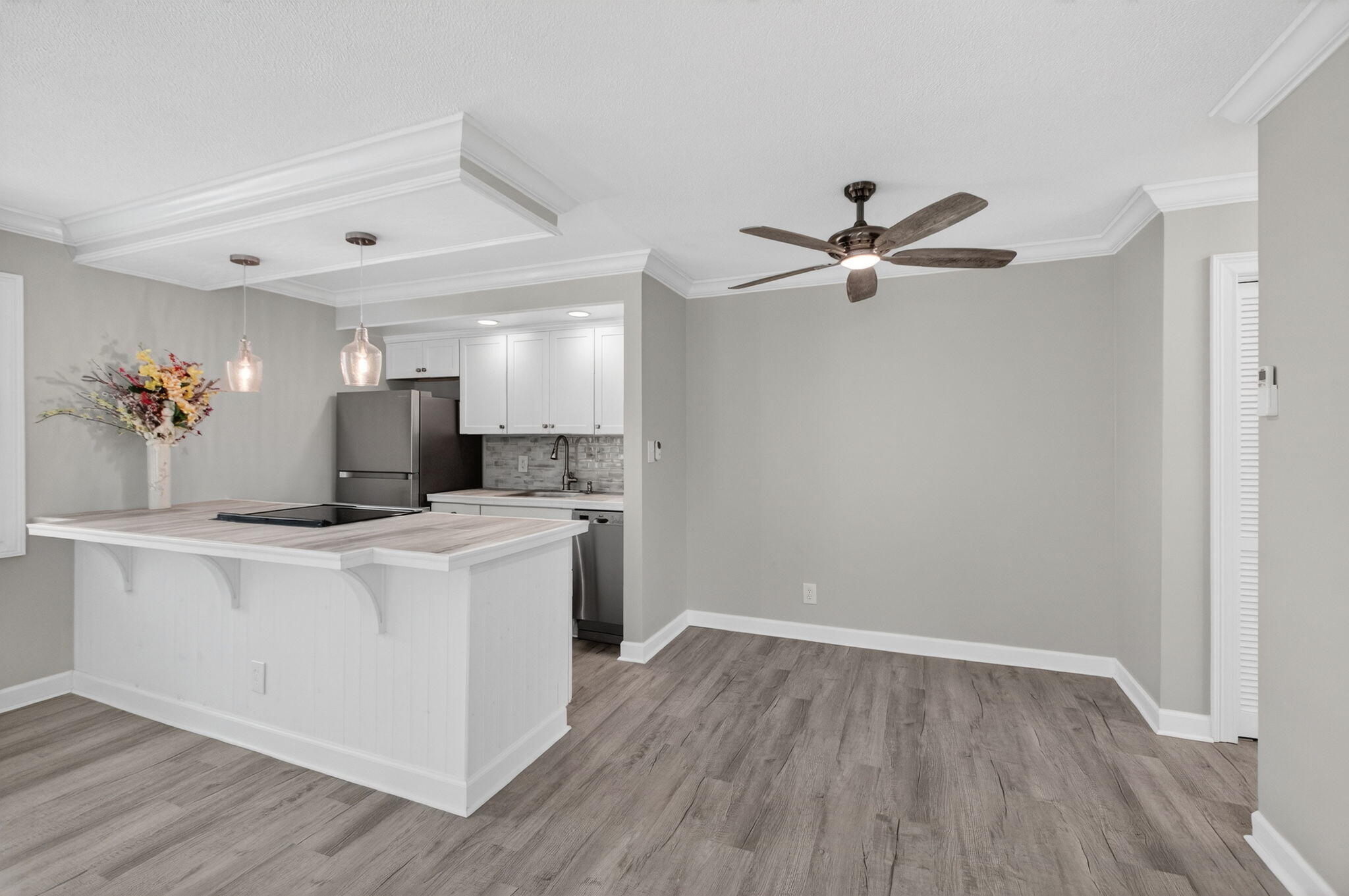 3600 North Ocean Drive, Unit 223 Singer Island, FL 33404 - Photo 14 of 47 a view of kitchen with cabinets and wooden floor